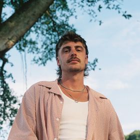 Australian drum and bass producer Christian Benson, known professionally as Luude.