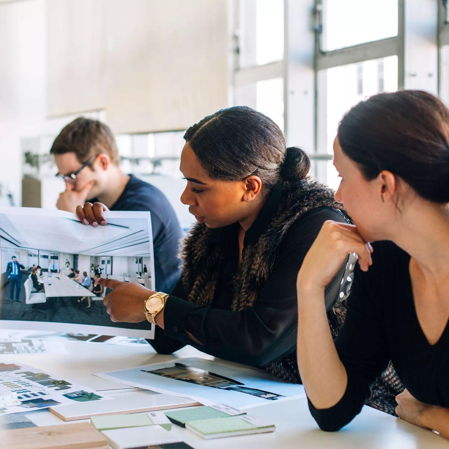 A person presenting an image to the team at Studio Pacific Architecture.