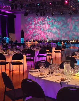 Amorkura Gallery inside Te Papa venues, filled with colourful LED lights, tables, and chairs.