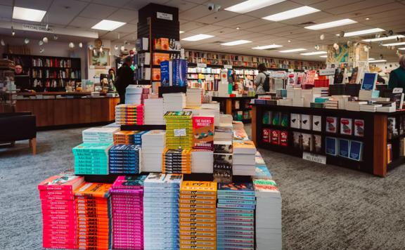 A pyramid-shaped pile of books inside Unity Books, a bookstore in Wellington, New Zealand.