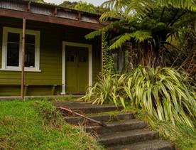 Camp Wainuiomata screen location. Has several buildings and is surrounded by forest and bush.