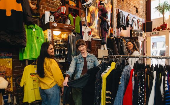 Three friends are shopping at Hunters & Collectors.