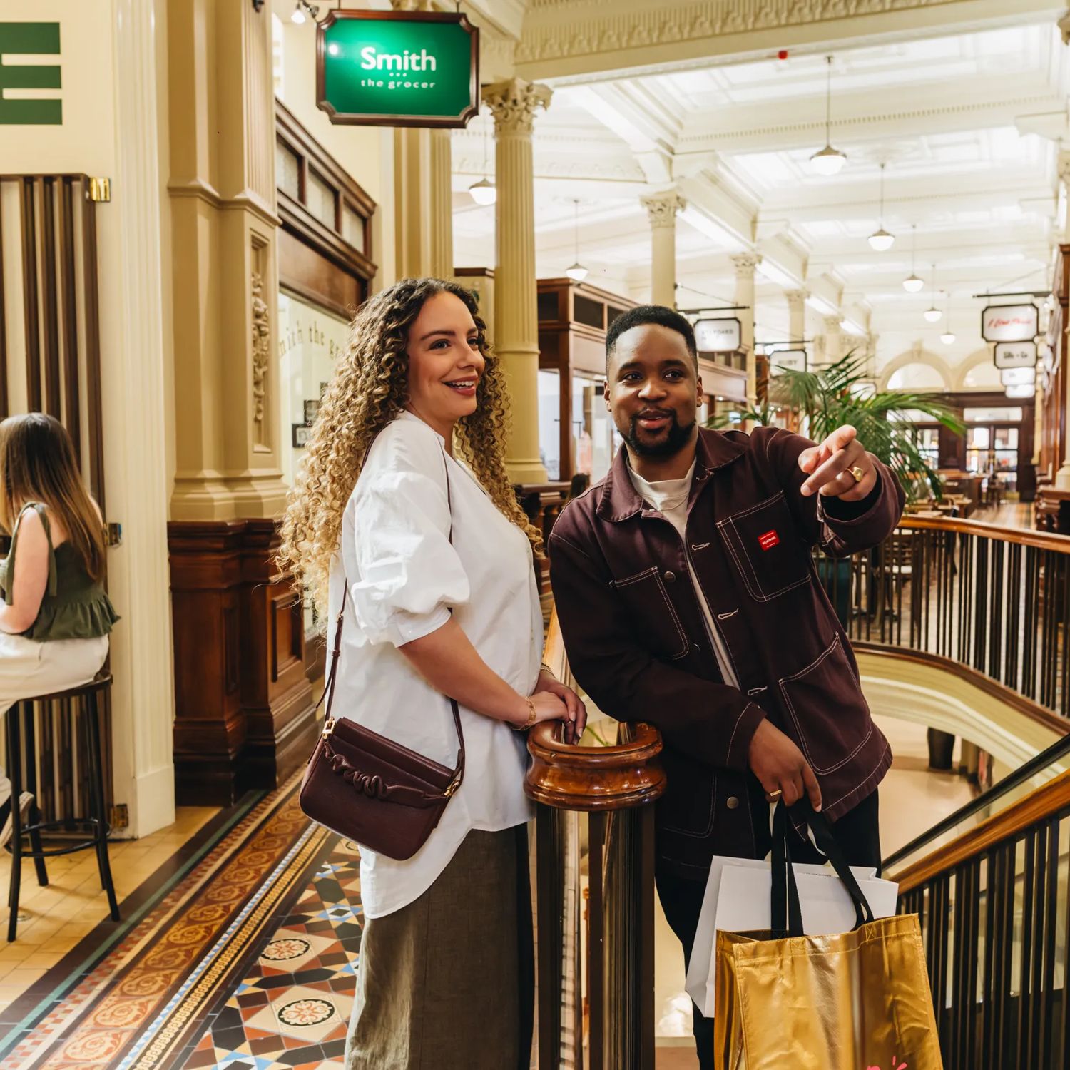 A young couple shopping at Olde Bank Arcade in Wellington.