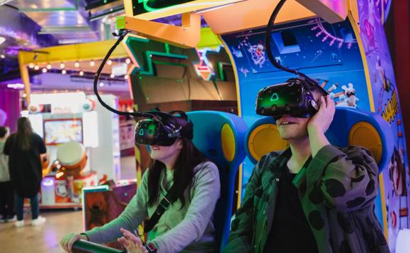 Two people playing a virtual reality video game at Willis Lane.