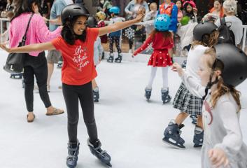 Children ice-skating at Christmas in the Quarters.