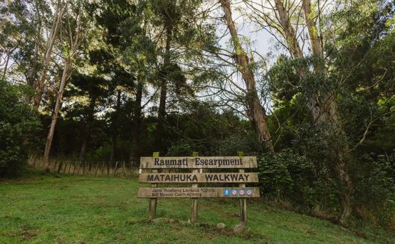 A large wooden sign at the start of the Mataihuka Walkway.