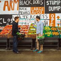 Two people shop for fruit at Moore Wilson's.