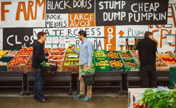 Two people shop for fruit at Moore Wilson's.