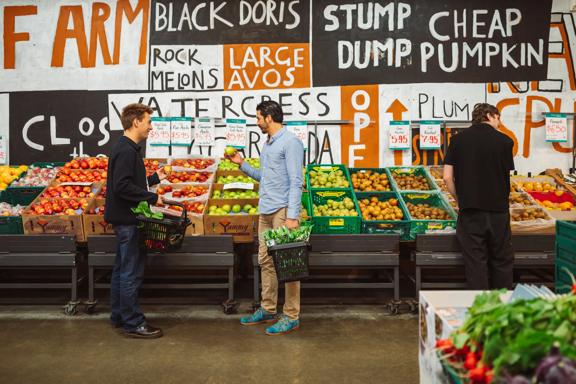 Two people shop for fruit at Moore Wilson's.