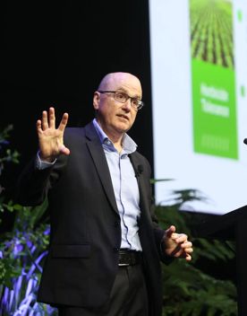 Person on stage presenting at Life Sciences Summit 2025.