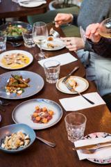 A spread of sharing plates, water glasses and wine at Havana Bar in Wellington.