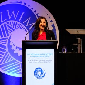 Prof. Helen Danesh-Meyer speaking on stage at the New Zealand Women in Medicine Conference 2024.