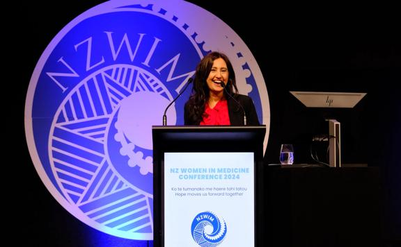 Prof. Helen Danesh-Meyer speaking on stage at the New Zealand Women in Medicine Conference 2024.