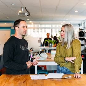 Kin recruitment and Storypark networking, collaborating in modern office space.