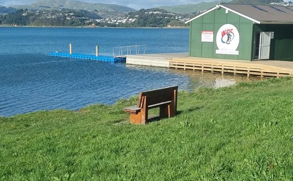 A bench seat overlooking the water on the Camborne Walkway.