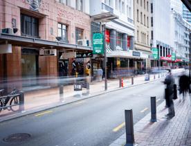 The mix of modern and old buildings along Lambton Quay, including the old supreme court, and old bank.