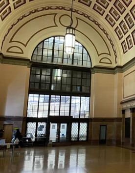 Interior of Wellington train station, looking up at the intricate arched ceiling.