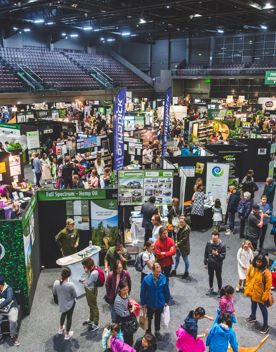 Vendor stalls inside the TSB Arena with lots of people exploring the products on offer
