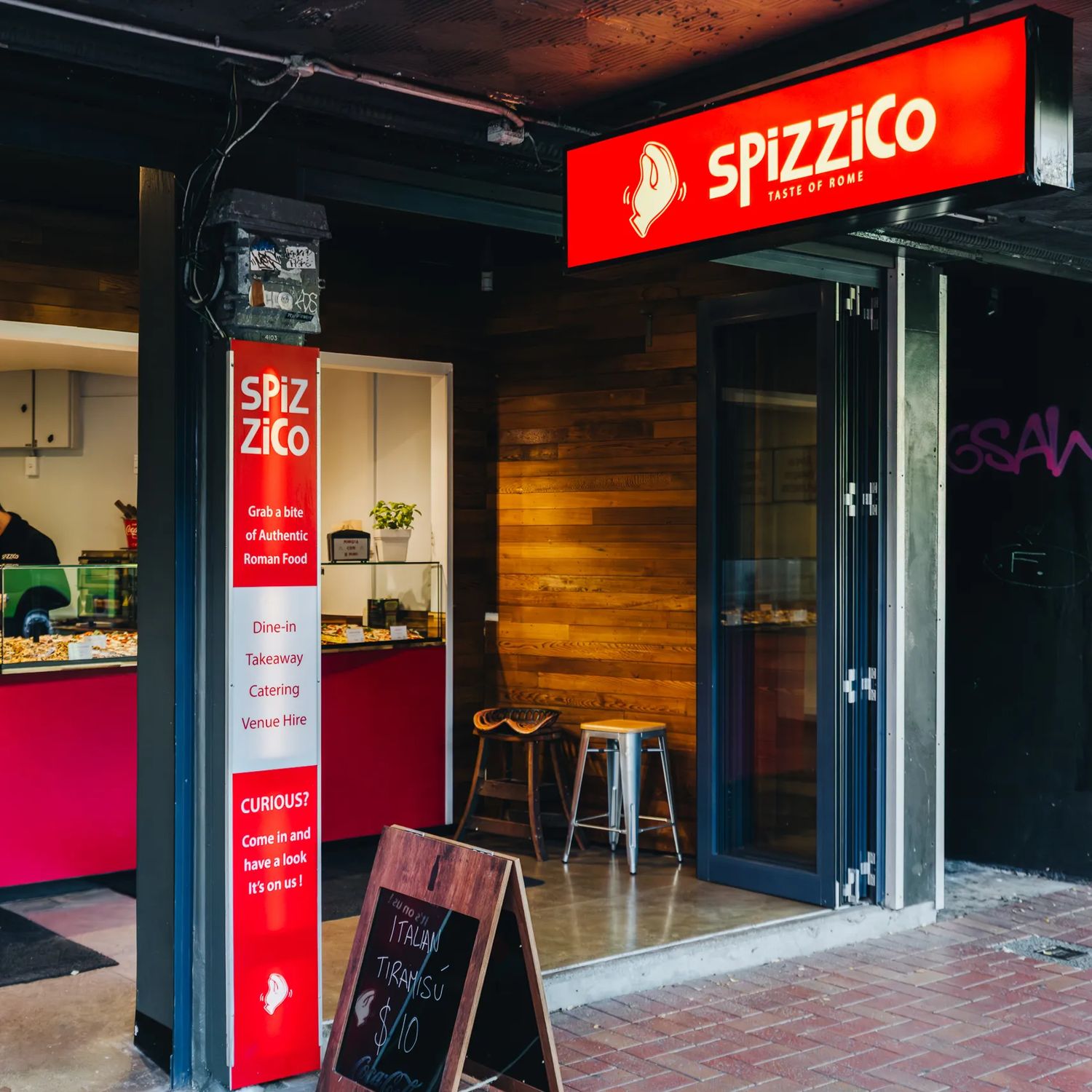 The entrance to Spizzico, a Roman-style pizzeria in Wellington.