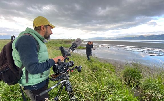 Person filming on the Ruamāhanga River