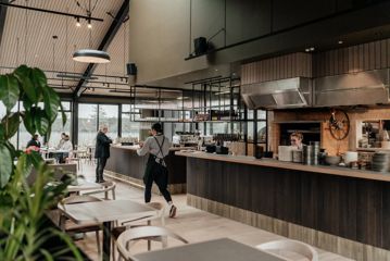 Industrial looking interior of The Runholder restaurant.