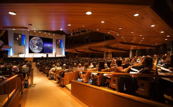 A full house audience inside michael Fowler Centre looking towards the stage.