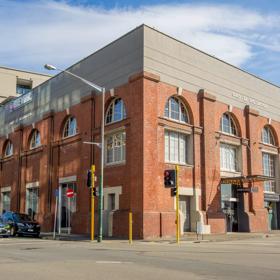 Exterior of Harbourside function centre, a large brick building.