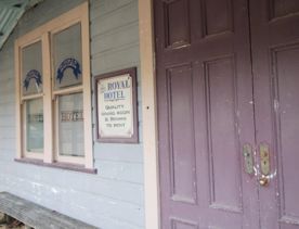 The screen location of Whiitemans Valley, nestled among trees and hills, old buildings have been built to mimic an old town.