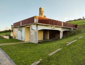 The screen location of West Wind Farm and Mākara Bunker at sunset, with 360 views of Wellington and the wind farm, as well as the historic fort Opau.