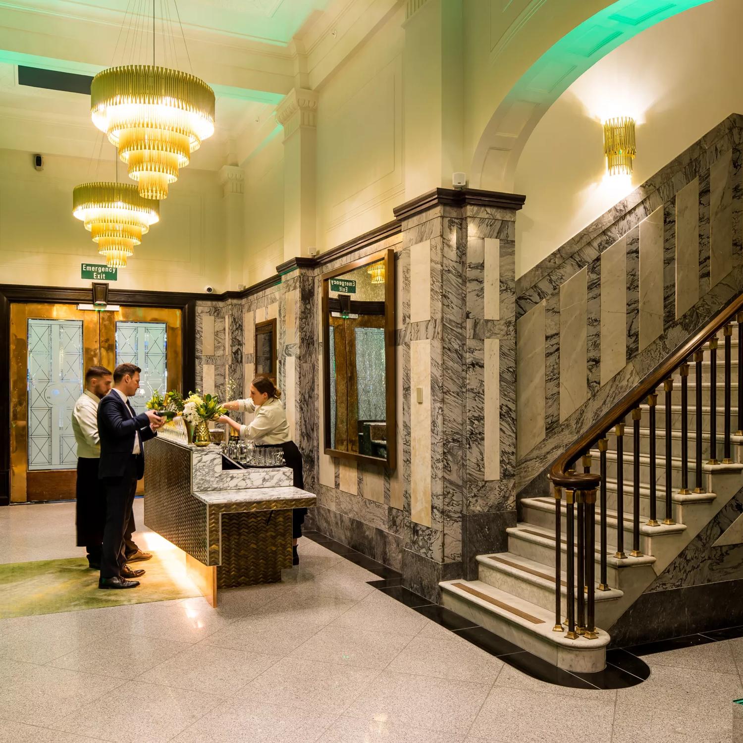 The Doubletreee by Hilton lobby, with grand marble staircases and gold finisings.