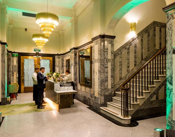 The Doubletreee by Hilton lobby, with grand marble staircases and gold finisings.