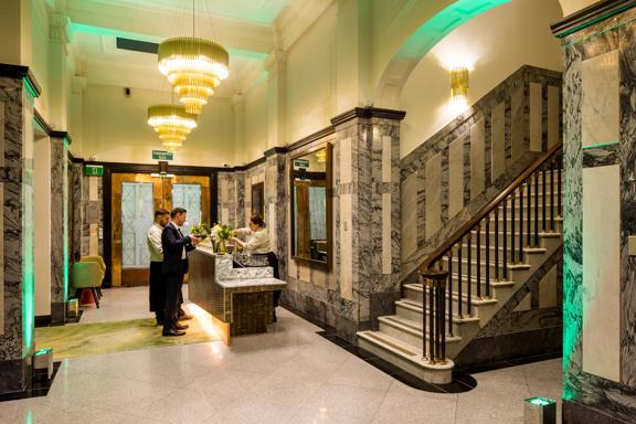 The Doubletreee by Hilton lobby, with grand marble staircases and gold finisings.