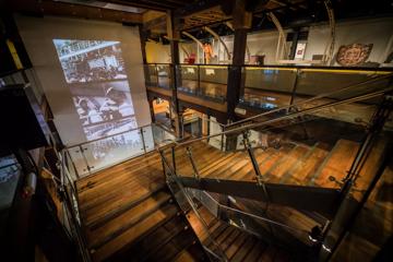 A wide, wooden staircase inside the Wellington Museum.