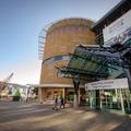 The exterior of Te Papa Tongarewa, half glass and half concrete.