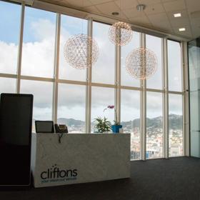 Lobby of Cliftons with large floor to ceiling windows overlooking the city.