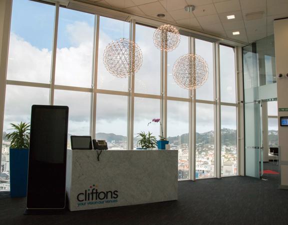 Lobby of Cliftons with large floor to ceiling windows overlooking the city.