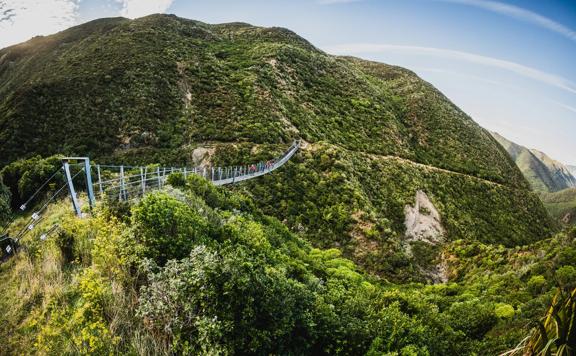 Cyclists going along the Siberia Gulley Bridge on the Remutaka Cycle Trail.