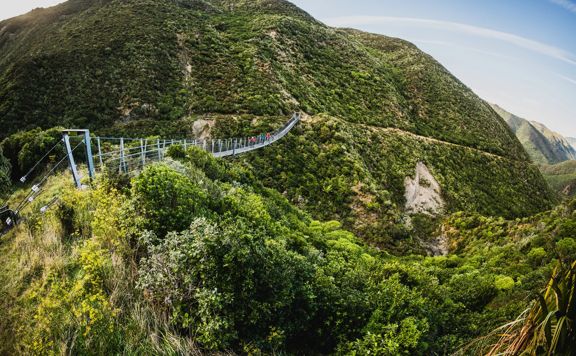 Cyclists going along the Siberia Gulley Bridge on the Remutaka Cycle Trail.