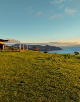 The screen location of West Wind Farm and Mākara Bunker at sunset, with 360 views of Wellington and the wind farm, as well as the historic fort Opau.