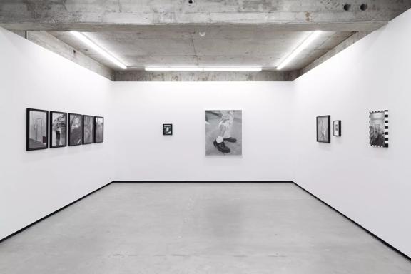 The interior of Jhana Millers, an art gallery located on Victoria Street in Te Aro, Wellington. A black and white photography exhibition is on display.