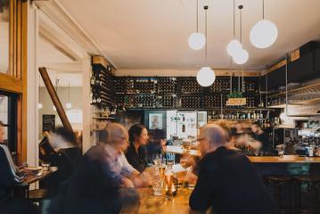 Inside a bustling fancy wine bar.