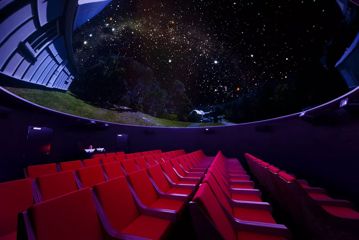 Looking up at the digital planetarium inside Space Place.