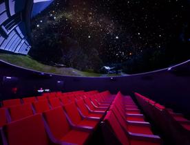 Looking up at the digital planetarium inside Space Place.