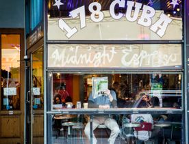 The front facade of Midnight Espresso, a bustling café located on Cuba Street in Te Aro, Wellington.
