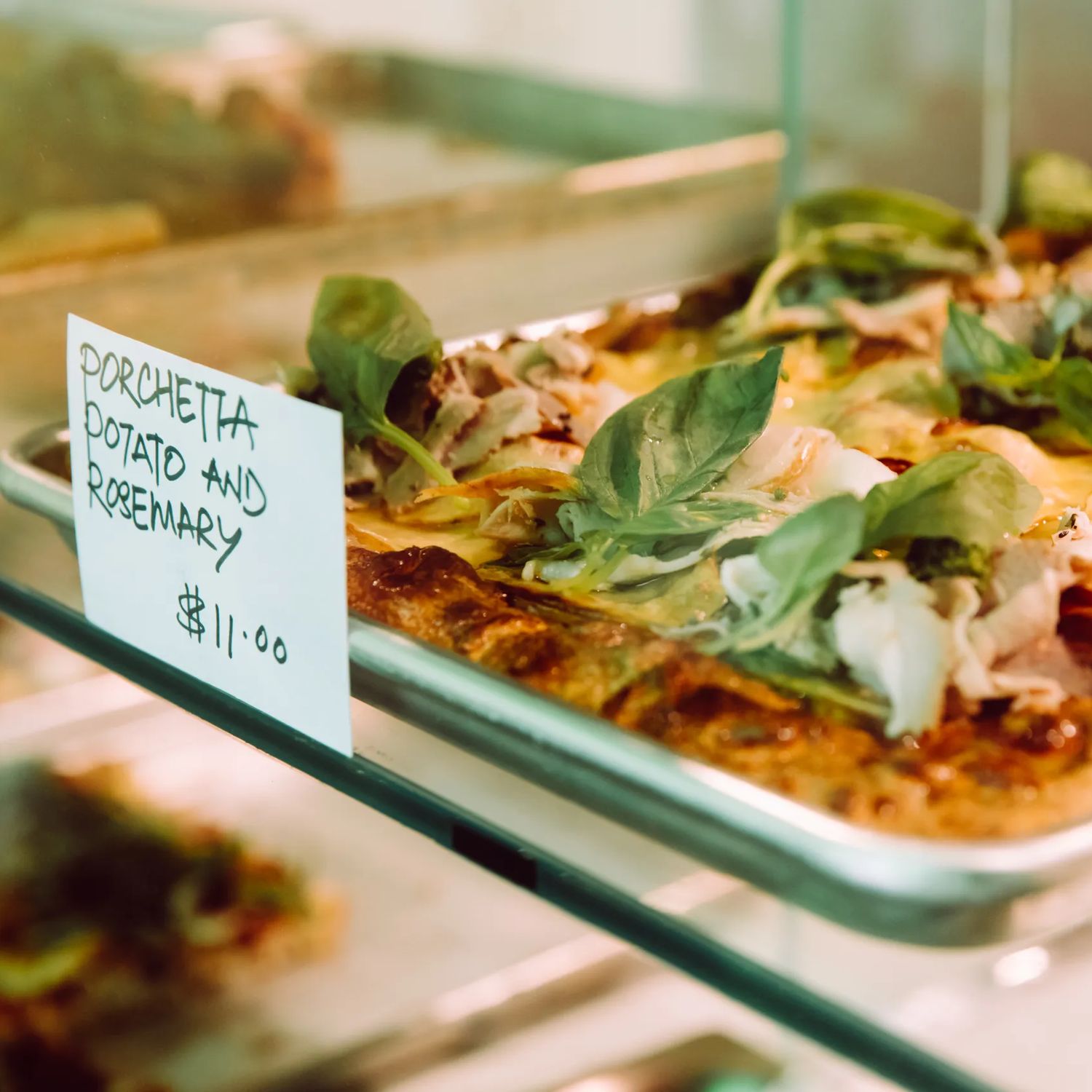 Porchetta, potato and rosemary pizza on sale at Slice