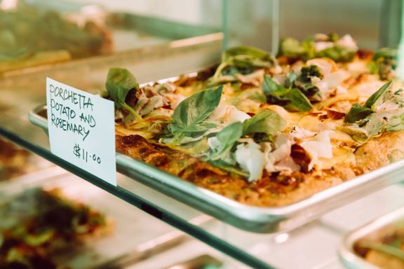 Porchetta, potato and rosemary pizza on sale at Slice