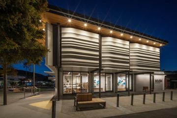 The exterior of Toi MAHARA gallery at night.