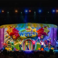 The Wiggles perform on stage.