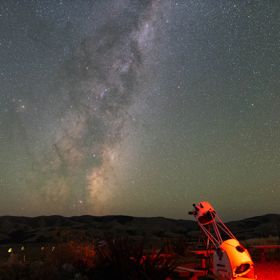 A telescope points toward a brilliant night sky over Wairarapa.