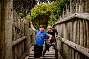 Wellingtonian Allan Henry, who plays the bear in ‘Cocaine Bear’, and his child, playing with swords inside the Wellington Zoo, pretending to be evil characters.